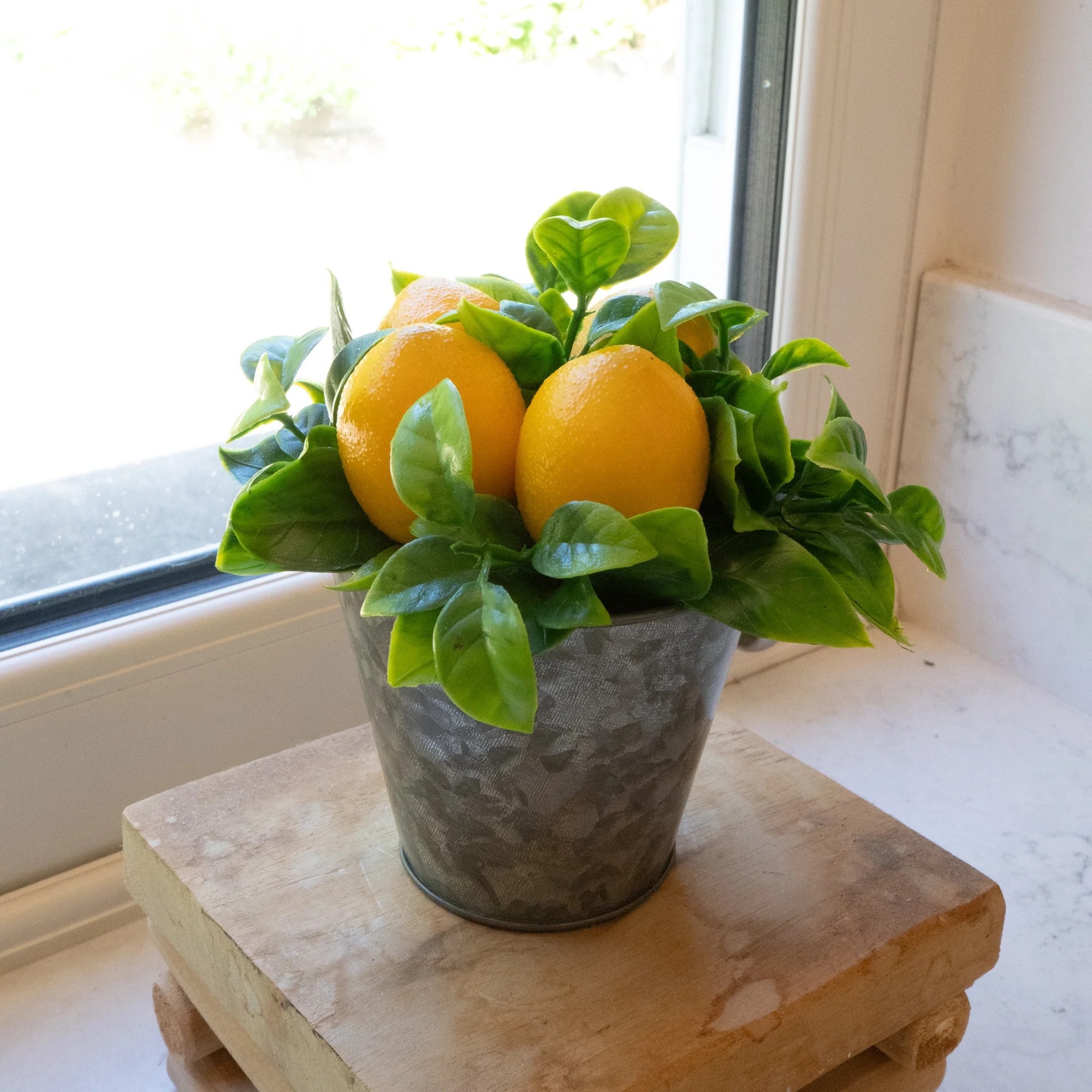 Decorative Lemons in a Tin