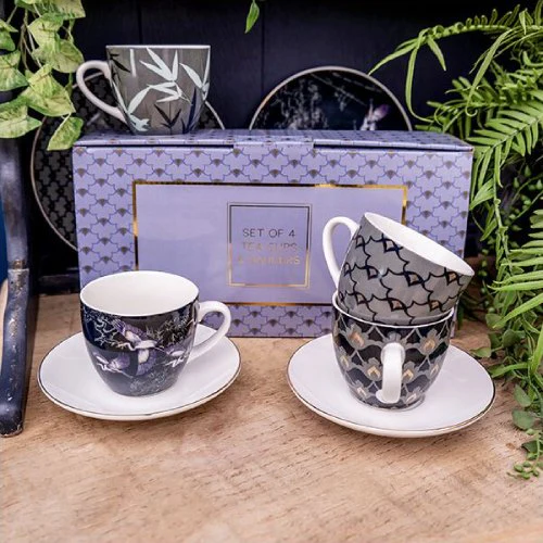 Set of Four Purple and White Patterned Teacups and White Saucers